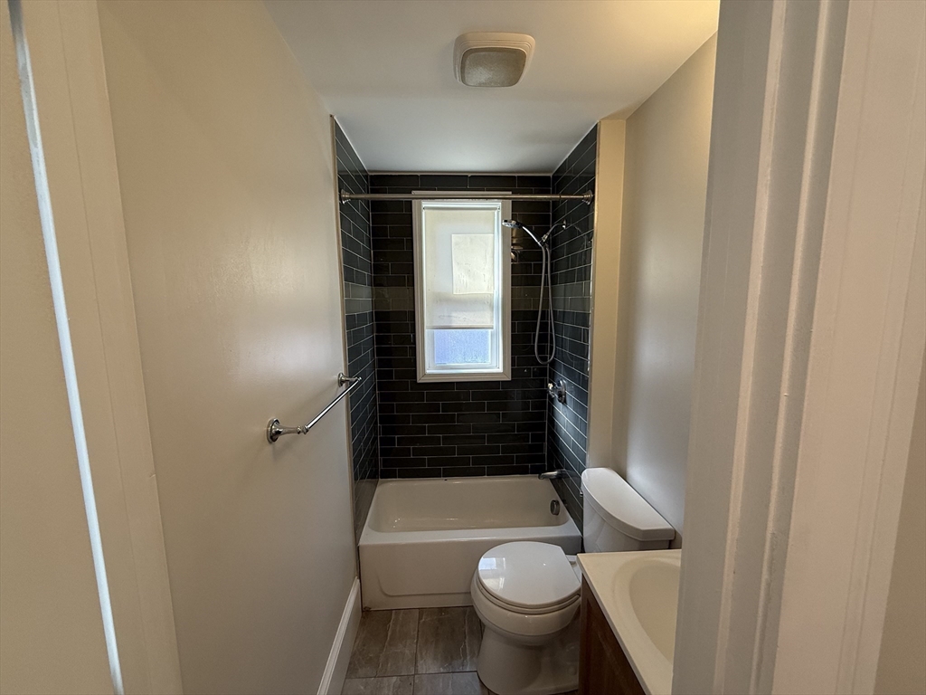 55 Iffley Road, Unit 3 Boston, MA 02130 - Photo 6 of 12 a bathroom with a sink and toilet