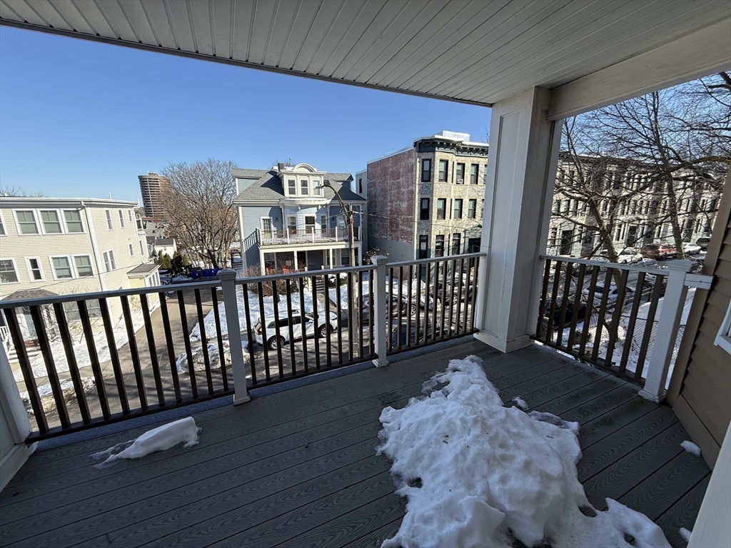 55 Iffley Road, Unit 3 Boston, MA 02130 - Photo 8 of 12 a view of a porch with wooden floor