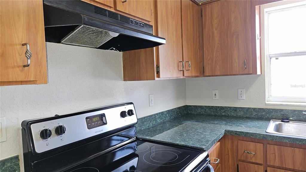 108 Brittany Road Mascotte, FL 34753 - Photo 6 of 17 a kitchen with a sink and cabinets