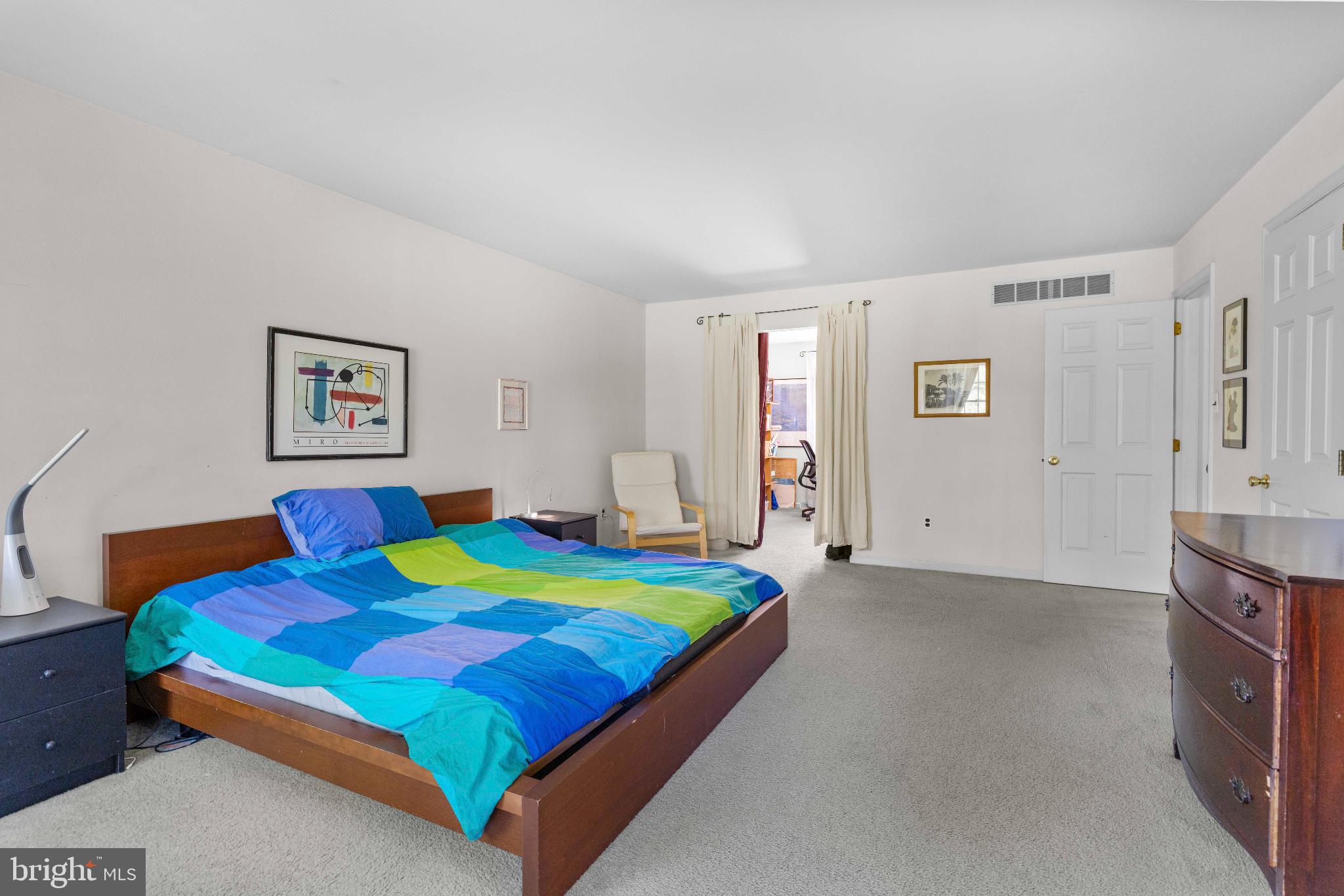 1478 Dillon Road Ambler, PA 19002 - Photo 20 of 42 a bedroom with a bed and a table in it