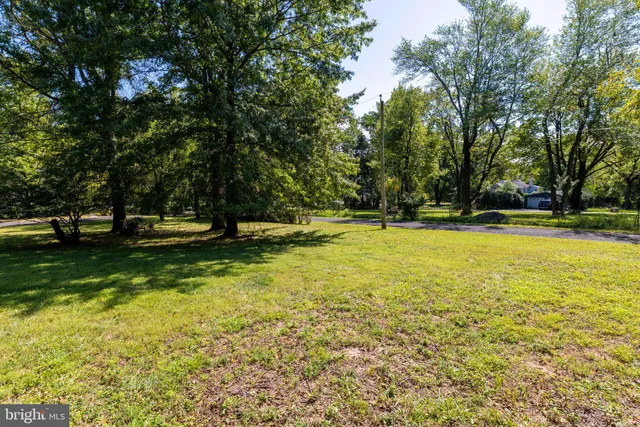 a view of swimming pool with a yard