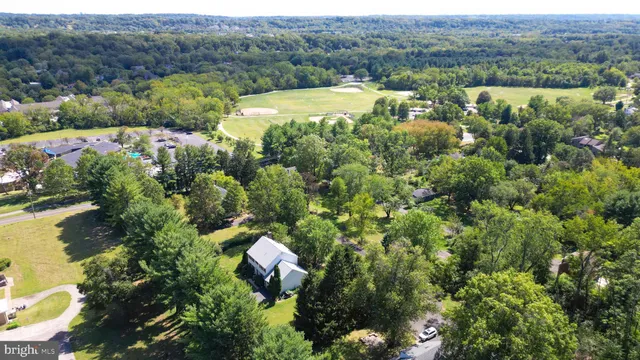an aerial view of a house with mountain view