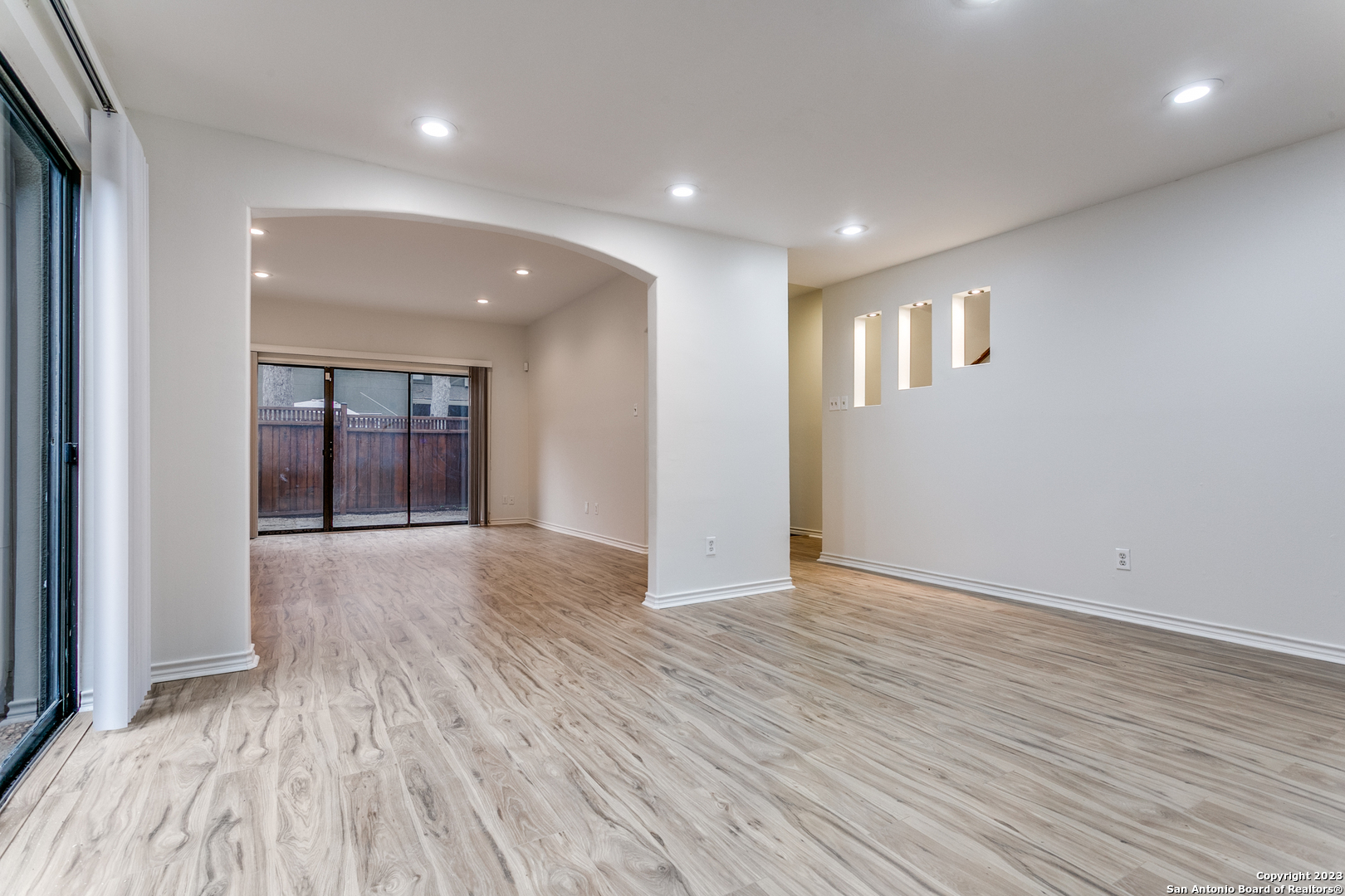 145 Terrell Road San Antonio, TX 78209 - Photo 5 of 12 a view of an empty room with wooden floor