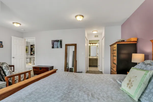 a bedroom with furniture and window