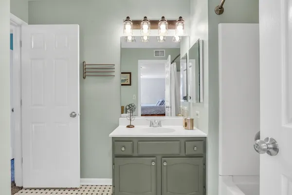 a bathroom with a sink and a mirror