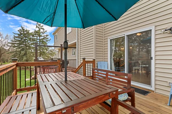 a view of a house with a yard and sitting area