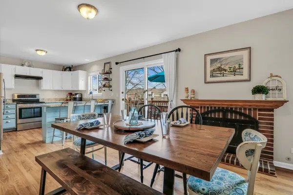 a dining room with furniture and window