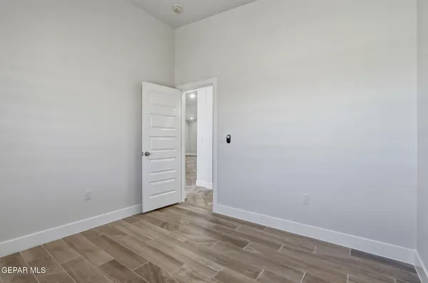 a view of storage and utility room with empty racks