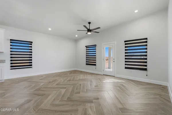 a view of an empty room with a window
