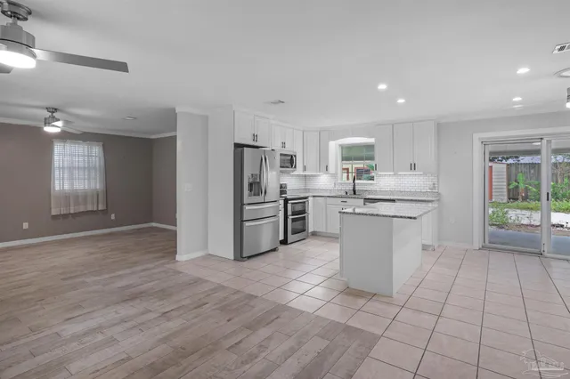 a kitchen with appliances cabinets and a sink