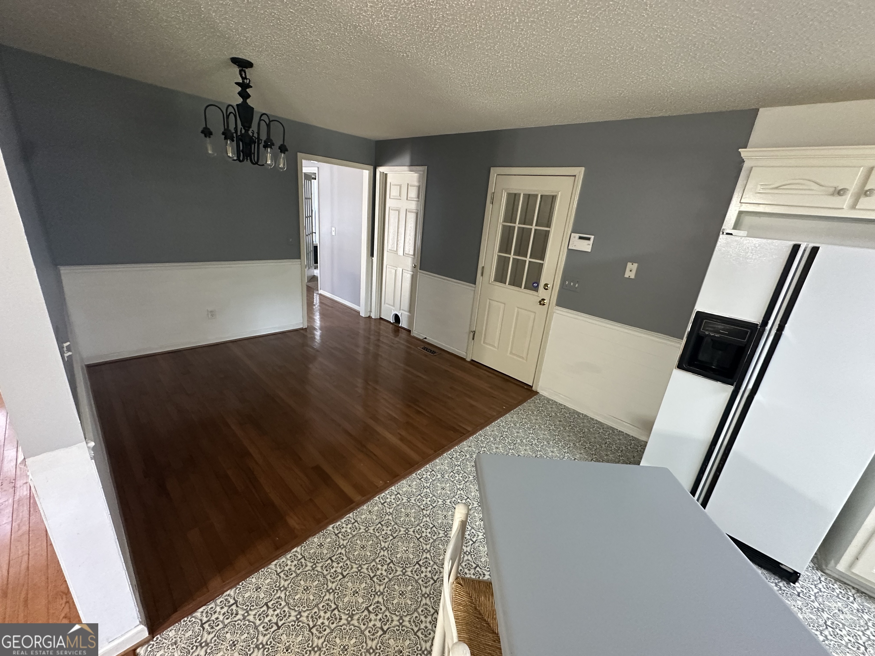 384 Sam Brown Boulevard Commerce, GA 30529 - Photo 5 of 25 a view of a living room with wooden floor and a fireplace