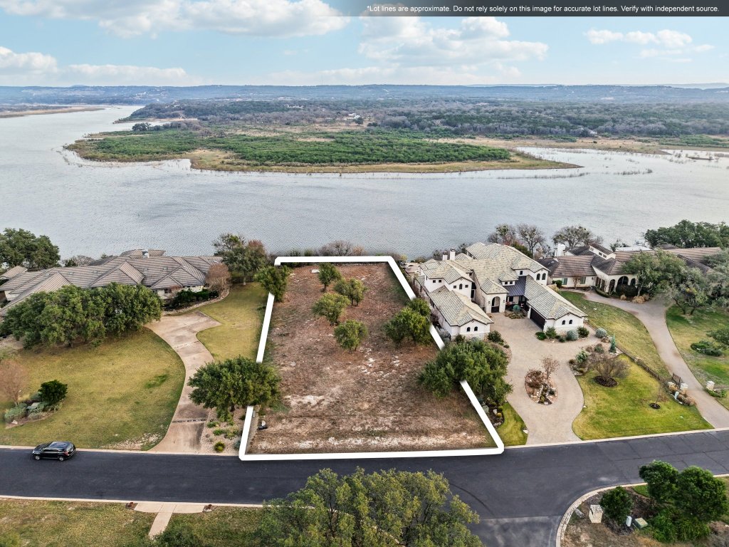 an aerial view of a residential houses with outdoor space