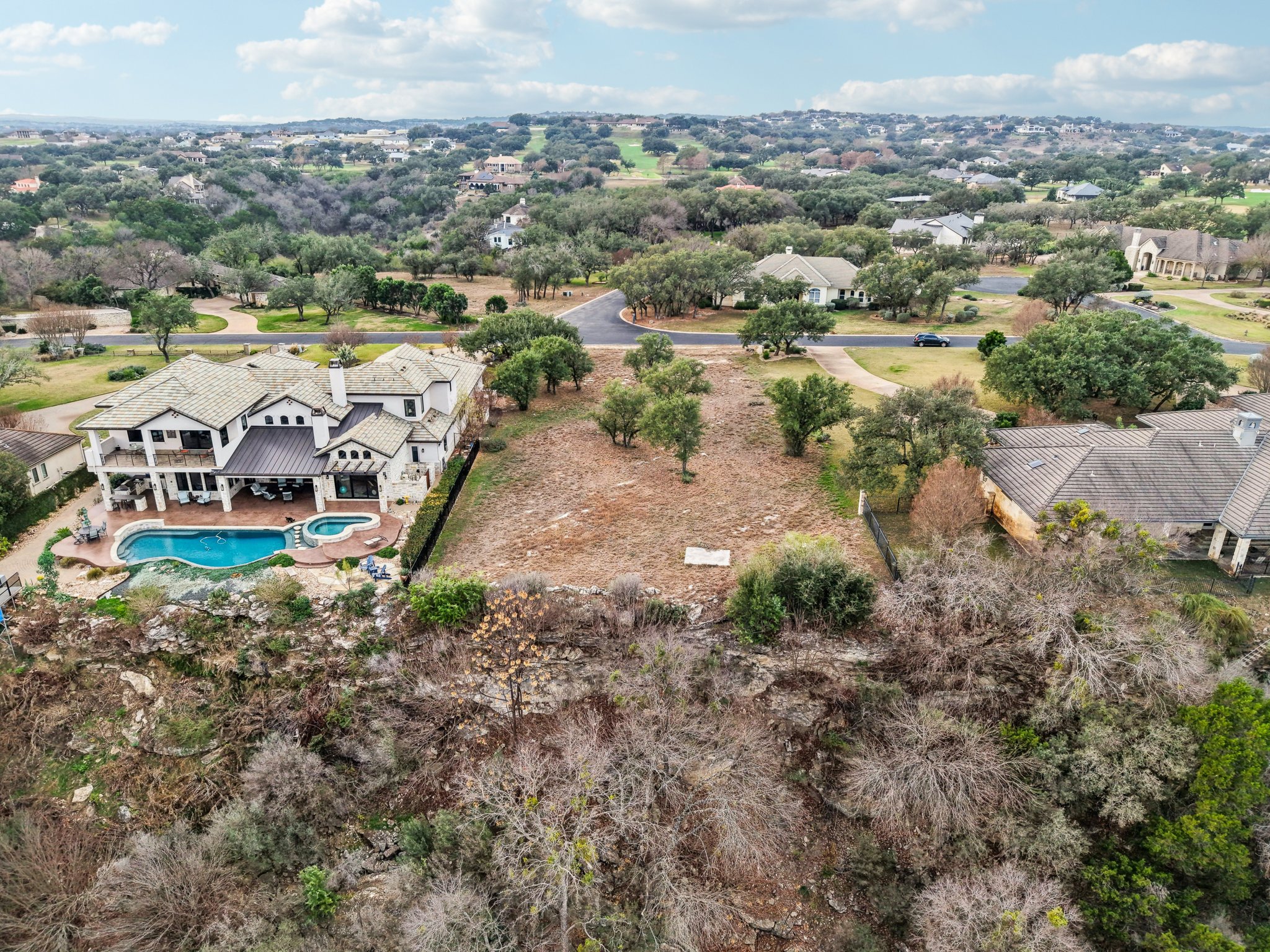 26710 Founders Place Spicewood, TX 78669 - Photo 13 of 19 an aerial view of a house with a yard and lake view