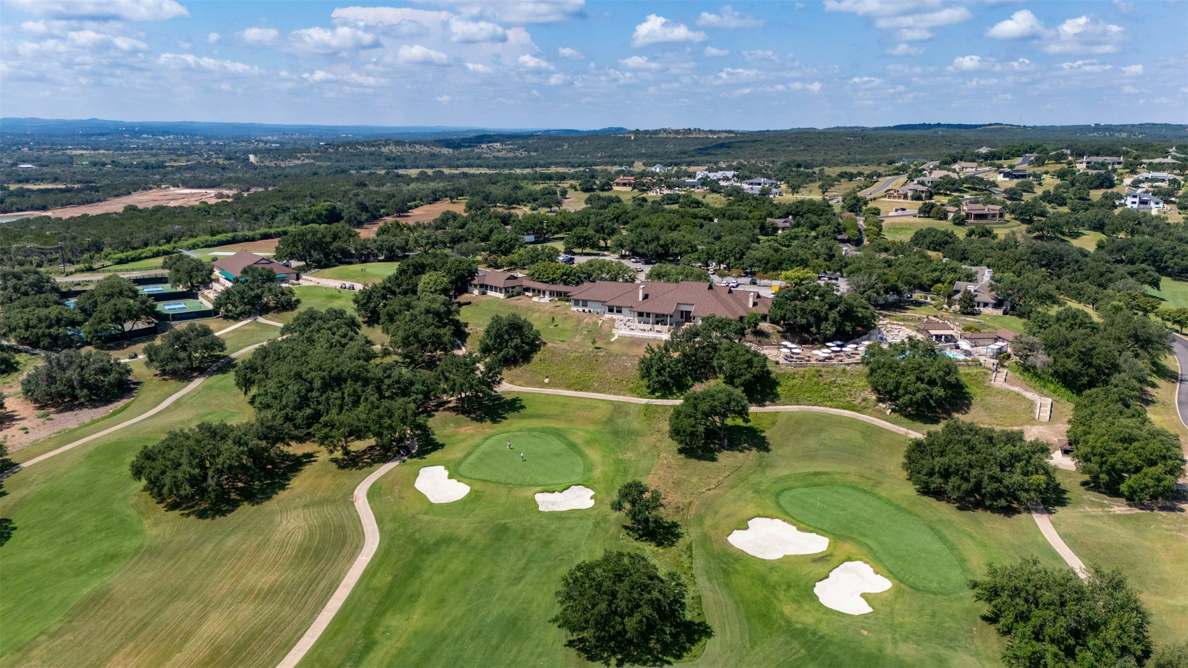 26710 Founders Place Spicewood, TX 78669 - Photo 15 of 19 an aerial view of residential houses with outdoor space and a lake view in back