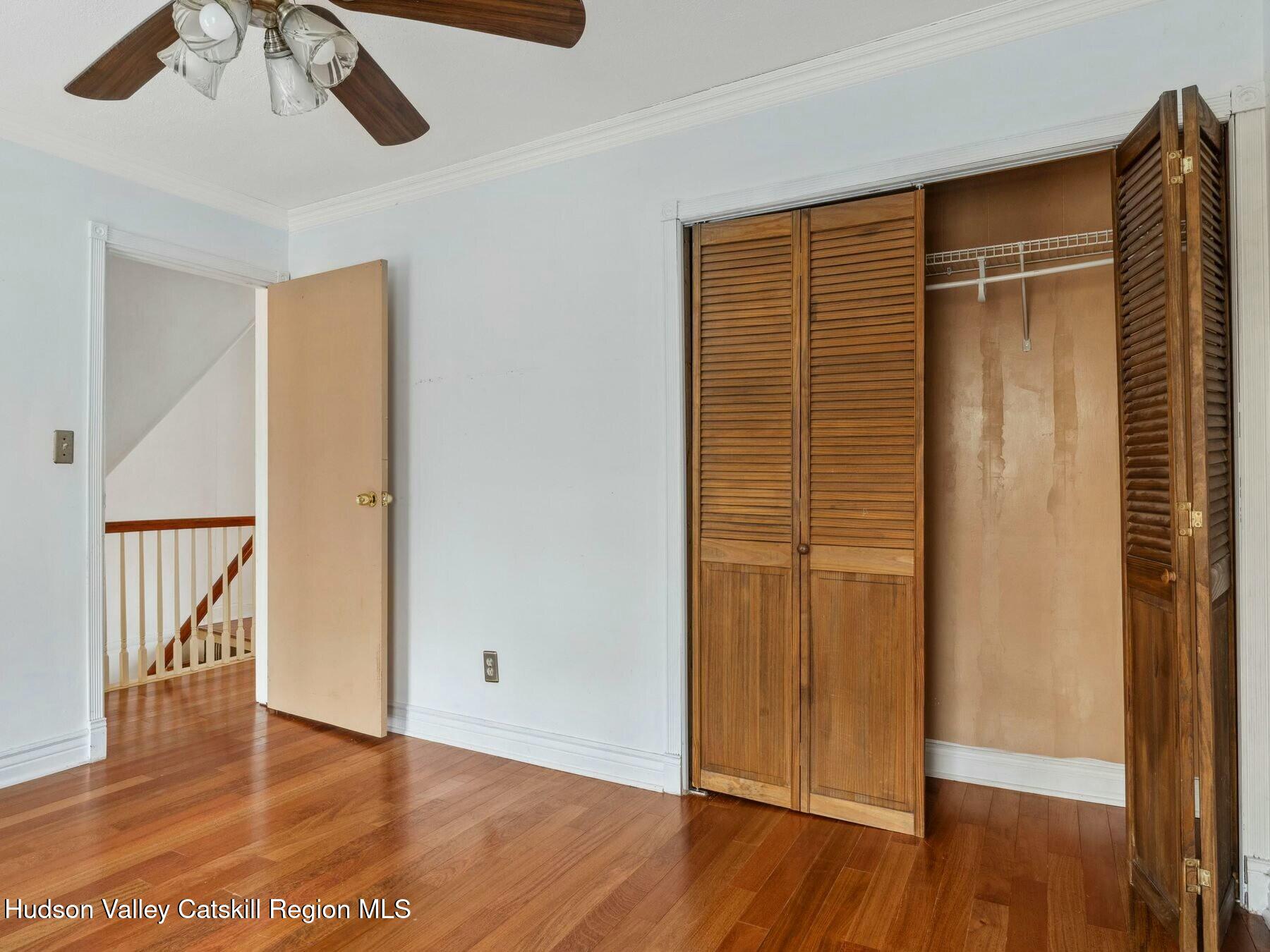 27 Brick Row Street Athens, NY 12015 - Photo 14 of 37 a view of an empty room with wooden floor and a window