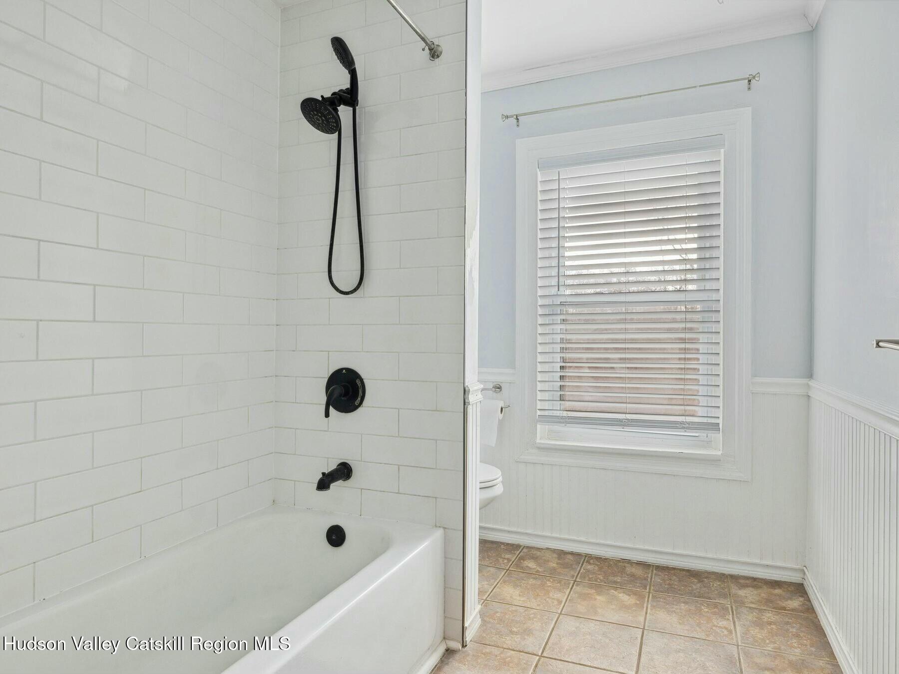 27 Brick Row Street Athens, NY 12015 - Photo 16 of 37 a bathroom with a bath tub