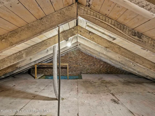 a view of a backyard with parking space