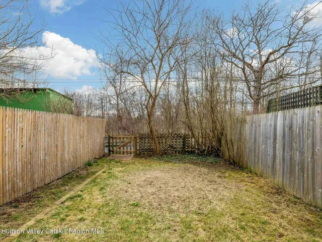 a view of a backyard of the house