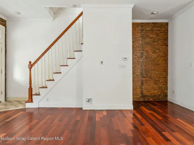 a view of entryway with wooden floor