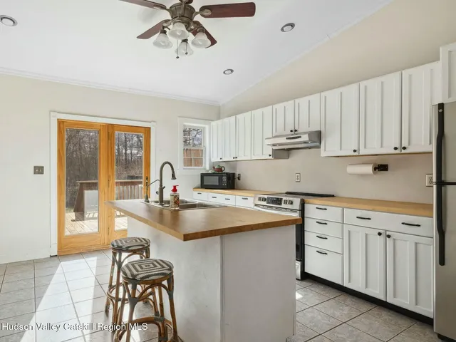 a kitchen with cabinets a sink and appliances