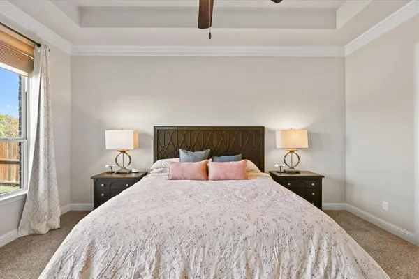 a bedroom with a bed and window