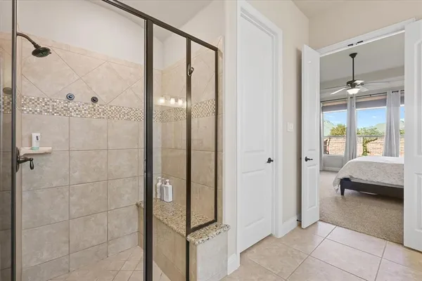 a bathroom with a shower and a sink