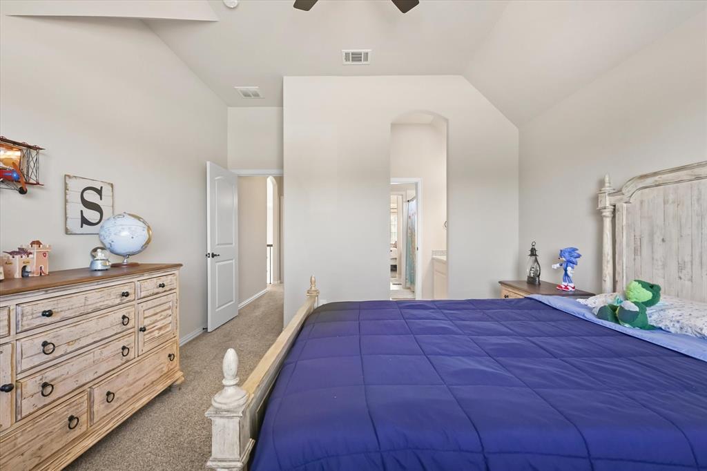 14006 Stars Road Frisco, TX 75035 - Photo 29 of 38 a bedroom with a bed and a dresser