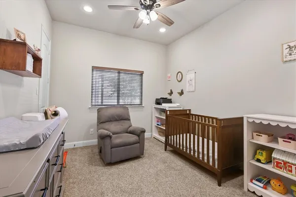 a bedroom with furniture and a window