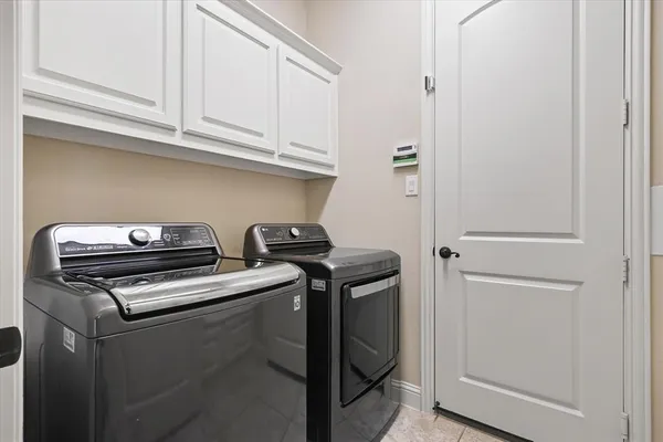 a view of storage and utility room with washer and dryer