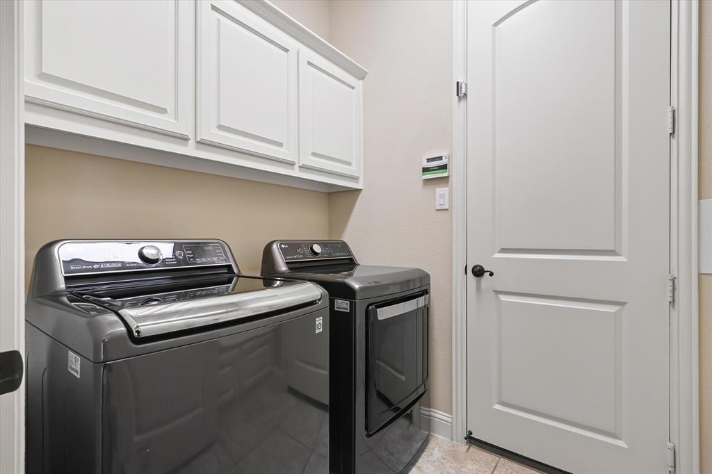 14006 Stars Road Frisco, TX 75035 - Photo 33 of 38 a view of storage and utility room with washer and dryer