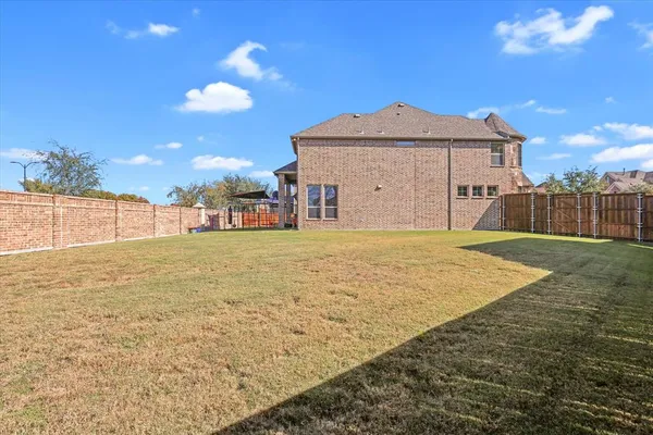 a view of a large house with a yard