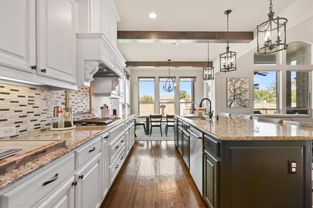 14006 Stars Road Frisco, TX 75035 - Photo 10 of 38 a kitchen with granite countertop lots of counter top space and stainless steel appliances