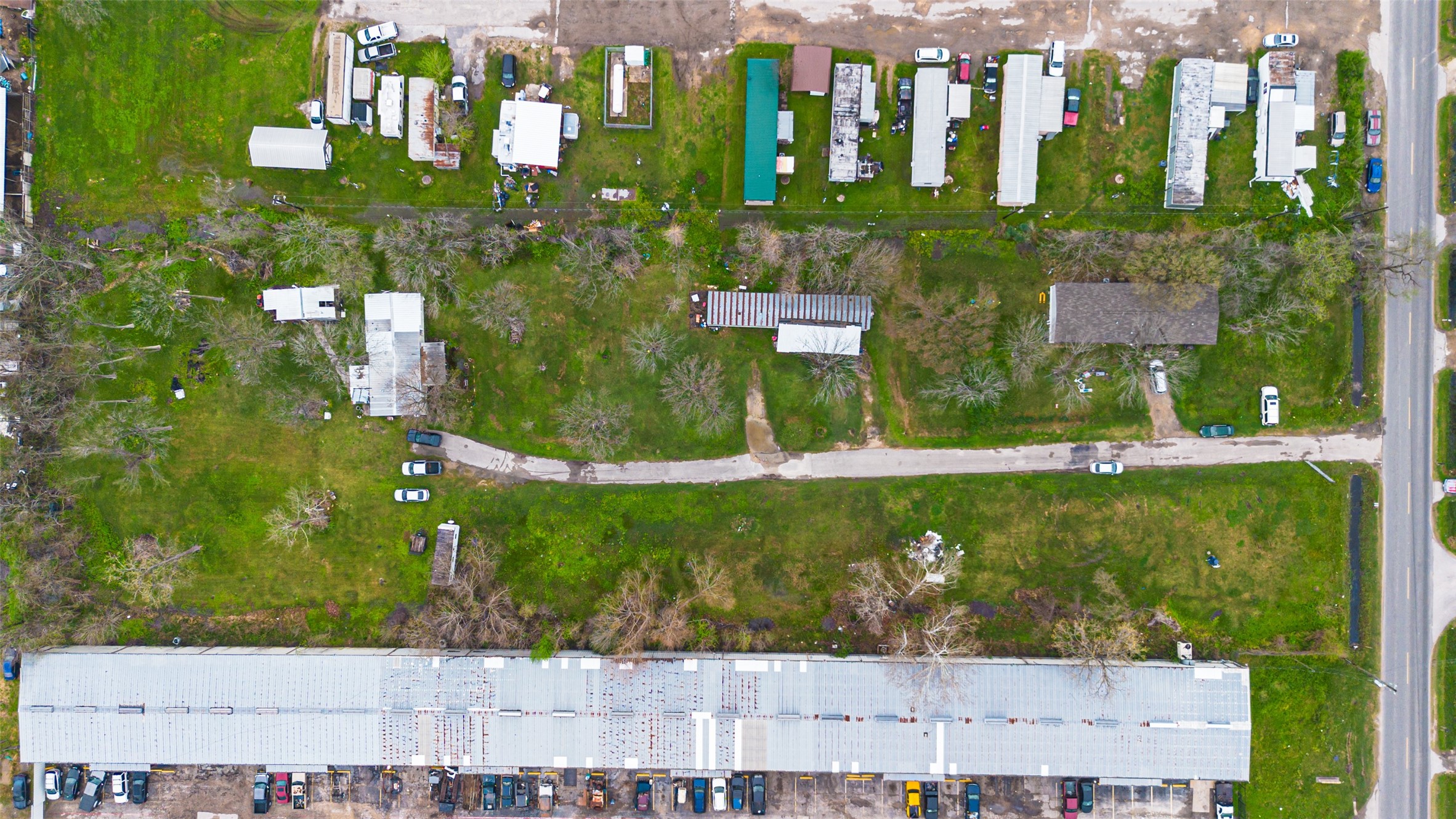 13423 Chrisman Road Houston, TX 77039 - Photo 5 of 18 an aerial view of residential houses with outdoor space and street view