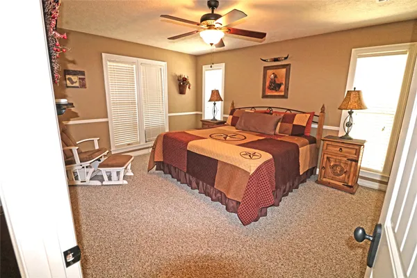 a dining room with furniture window and wooden floor