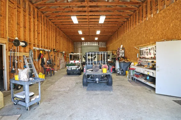 a view of water heater room with wooden floor