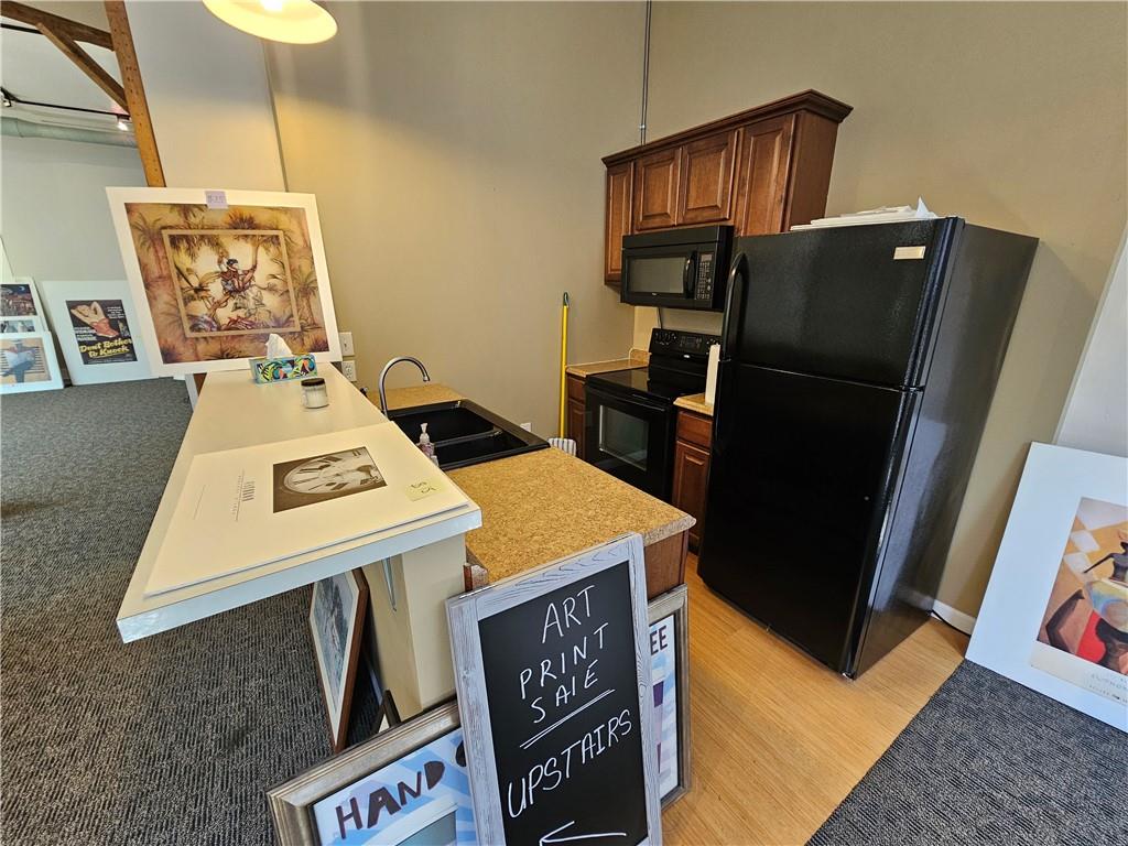 30 North Main Street, Unit 30 Washington, PA 15301 - Photo 4 of 15 a kitchen that has a sink and a refrigerator