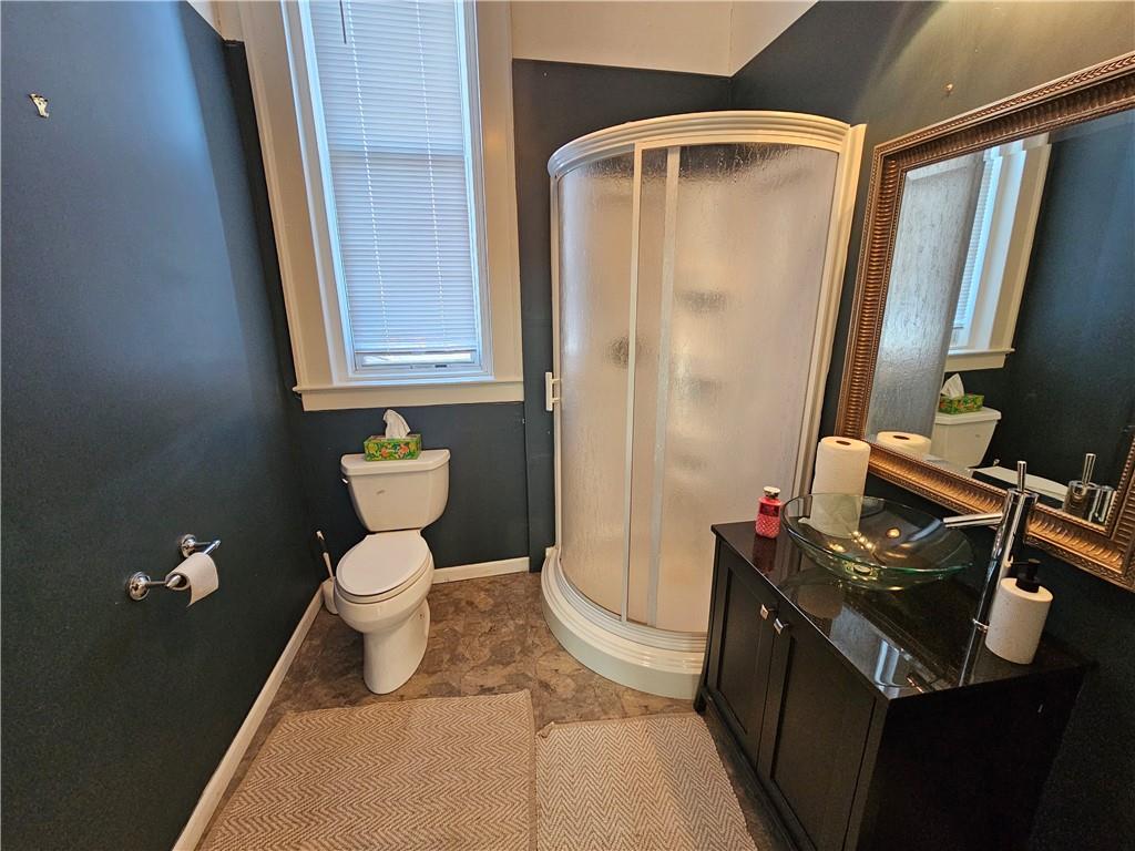 30 North Main Street, Unit 30 Washington, PA 15301 - Photo 5 of 15 a bathroom with a toilet a sink and a mirror