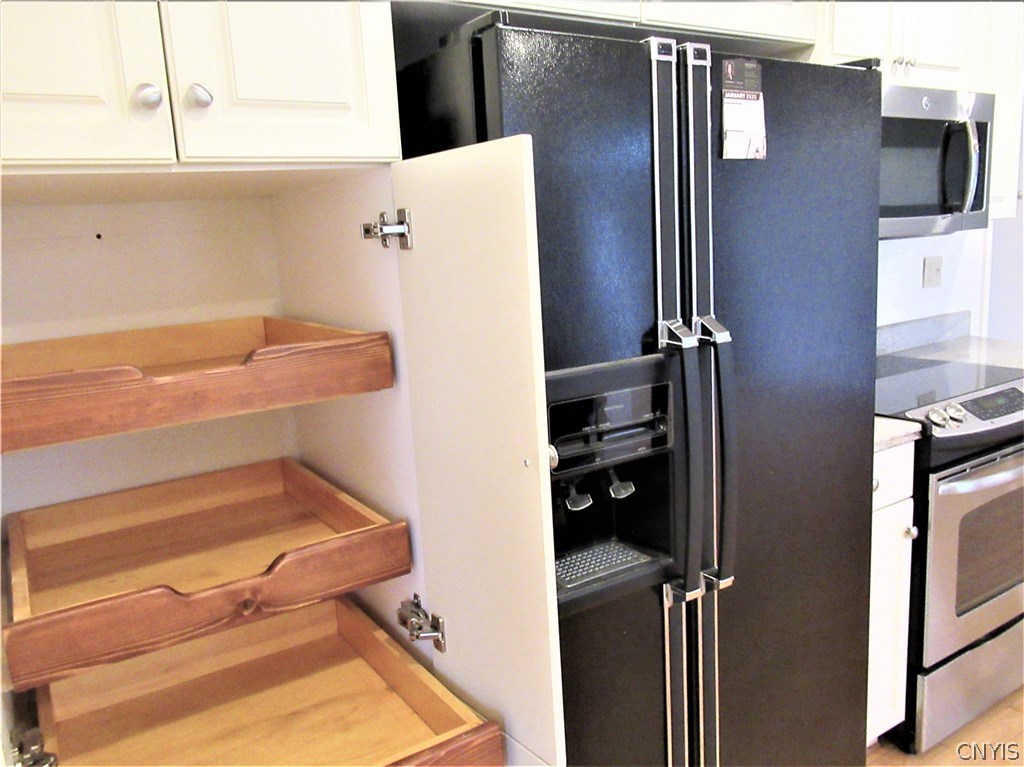 4546 Limestone Drive Manlius, NY 13104 - Photo 14 of 50 Convenient Roll out drawers in the cabinet pantry!