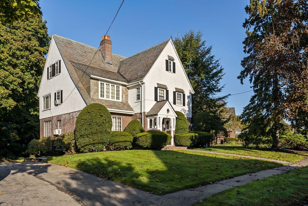 30 Pine Ridge Road Medford, MA 02155 - Photo 2 of 42 a front view of a house with a garden