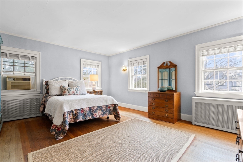 30 Pine Ridge Road Medford, MA 02155 - Photo 29 of 42 a spacious bedroom with a bed and a dresser next to a window