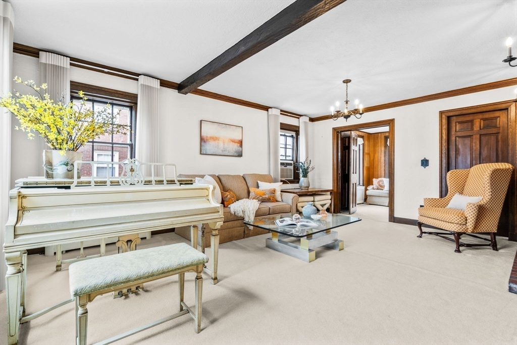 30 Pine Ridge Road Medford, MA 02155 - Photo 6 of 42 a living room with furniture and a chandelier