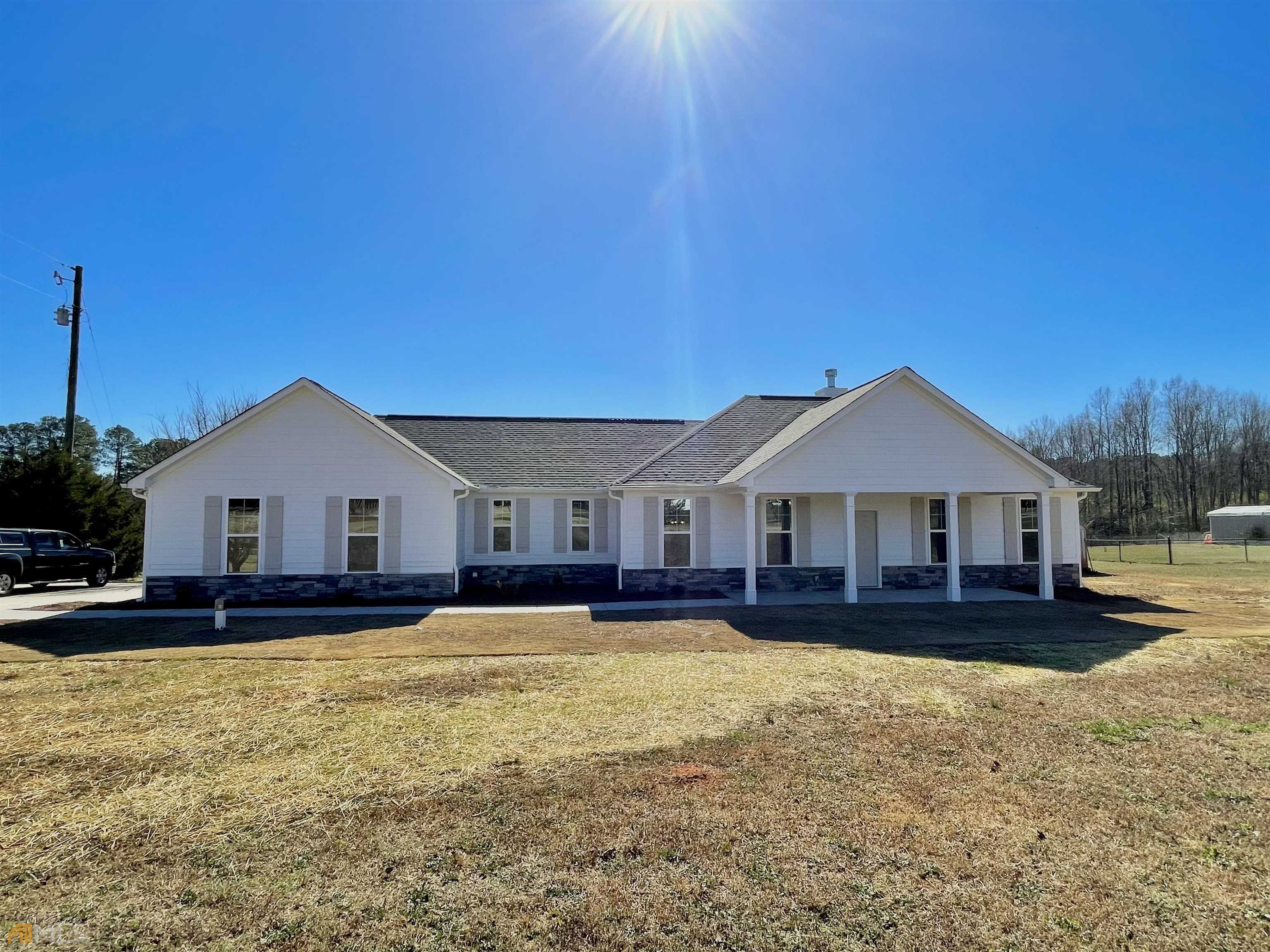 293 High Falls Road Jackson, GA 30233 - Photo 1 of 1 a front view of a house with a yard
