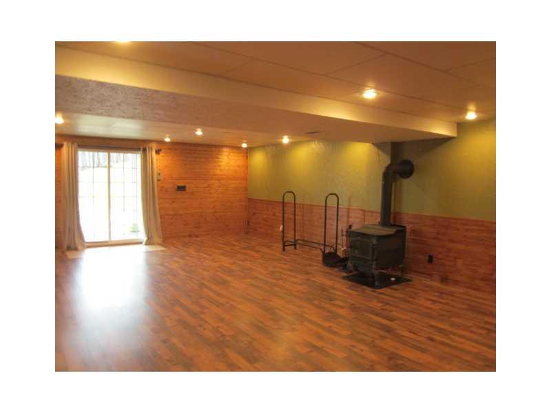 42 Goodhill Road Prosperity, PA 15329 - Photo 5 of 16 Family Room. Finished family room downstairs with wood burner for extra heat source and sliding glass doors