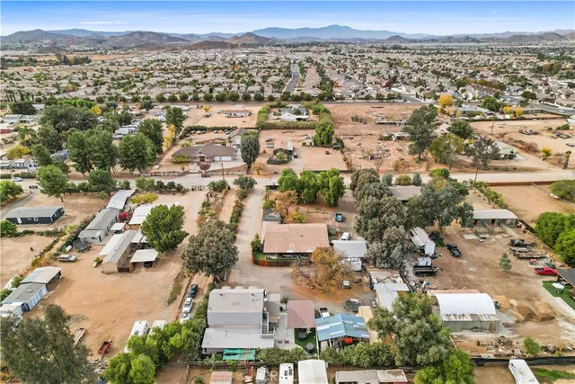 an aerial view of residential building with green space