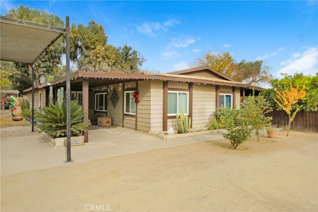 30640 Old Windmill Road Menifee, CA 92584 - Photo 6 of 14 a view of a house with a patio