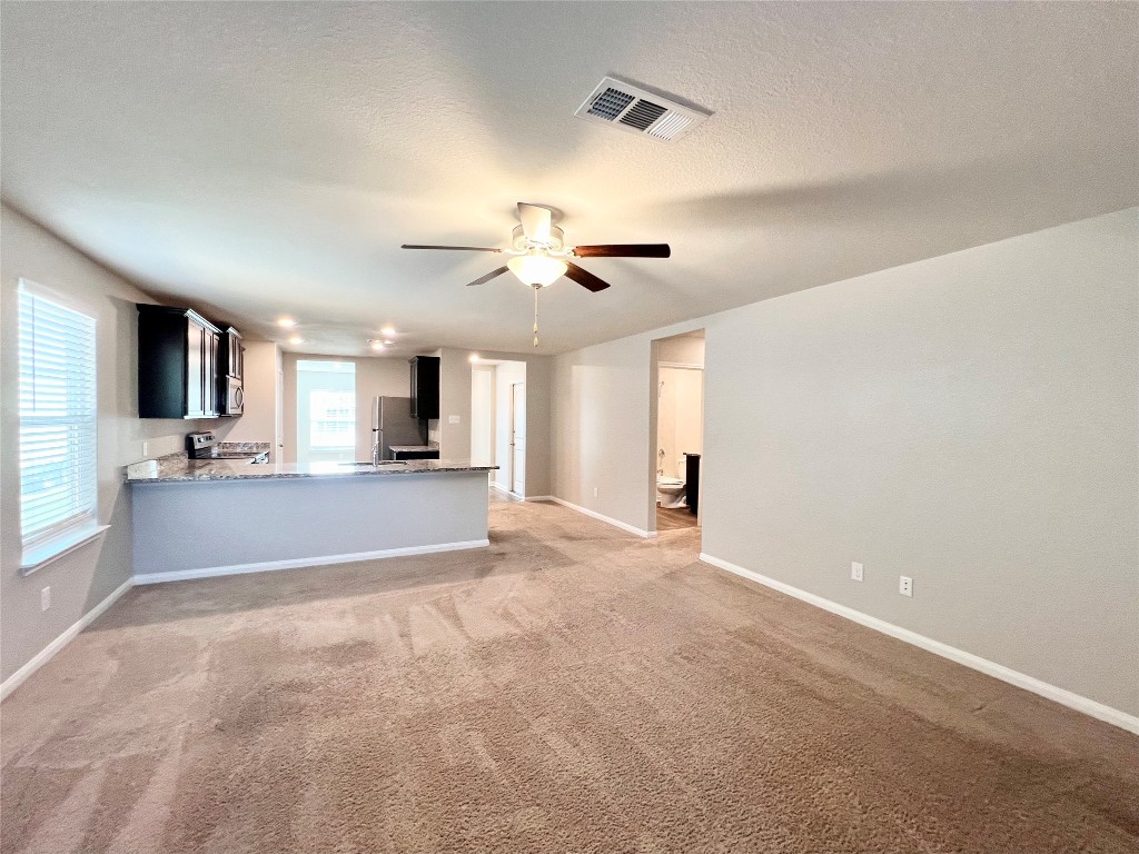 1033 Riverdale Cove Jarrell, TX 76537 - Photo 5 of 13 a view of a kitchen with a sink and a window