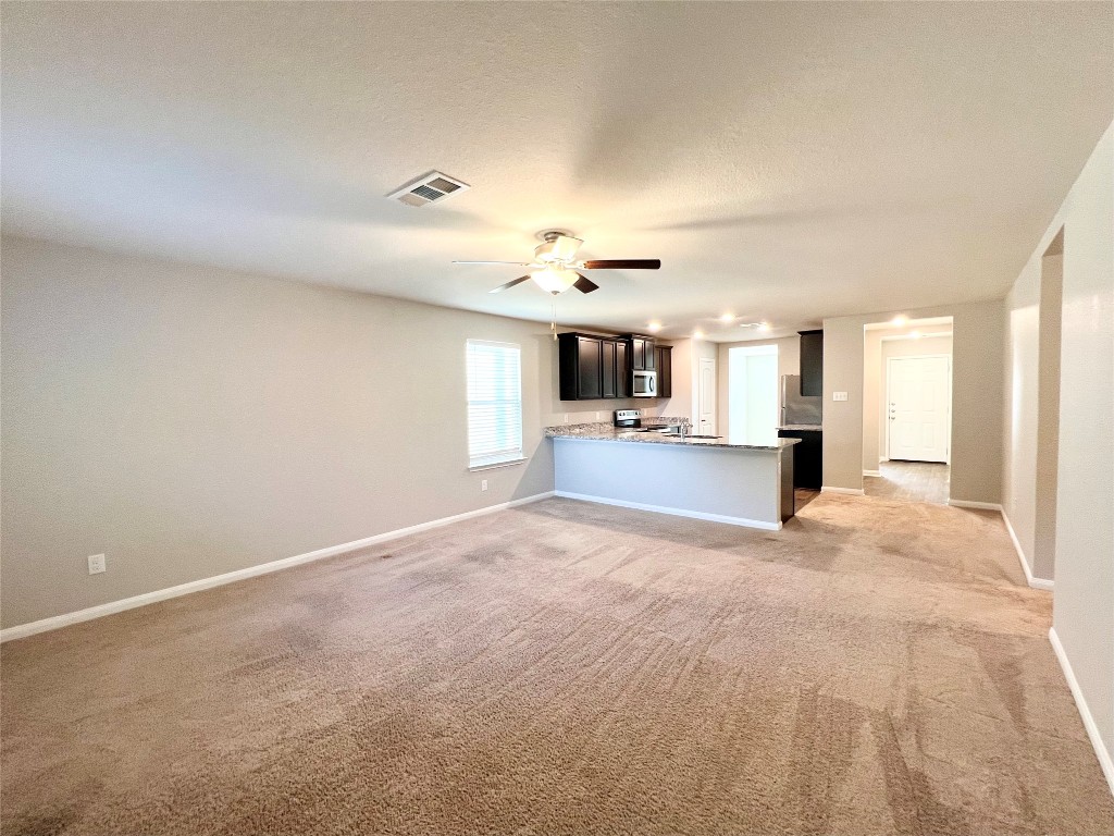 1033 Riverdale Cove Jarrell, TX 76537 - Photo 6 of 13 a view of a kitchen and a window in an empty room