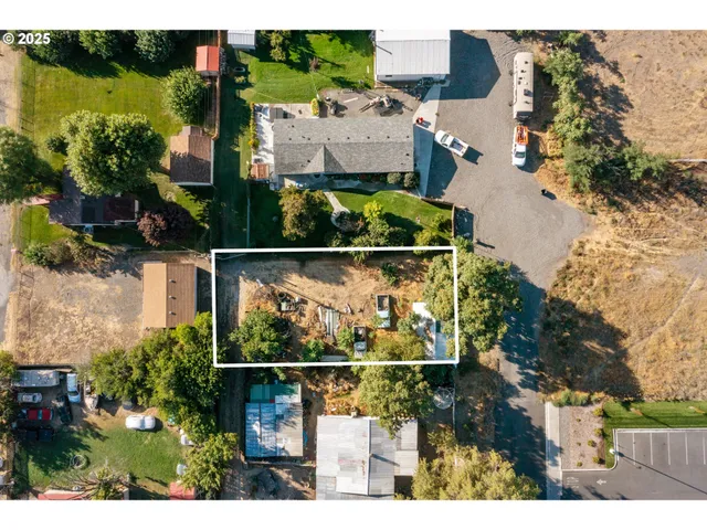 an aerial view of houses with outdoor space