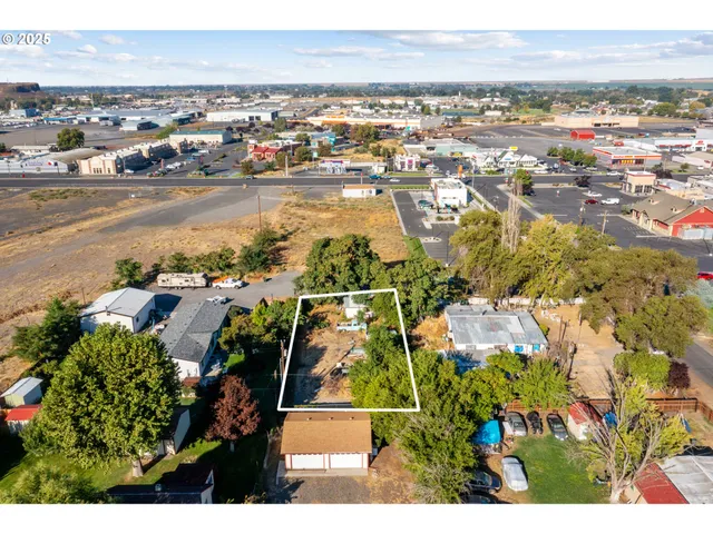 an aerial view of residential building and ocean