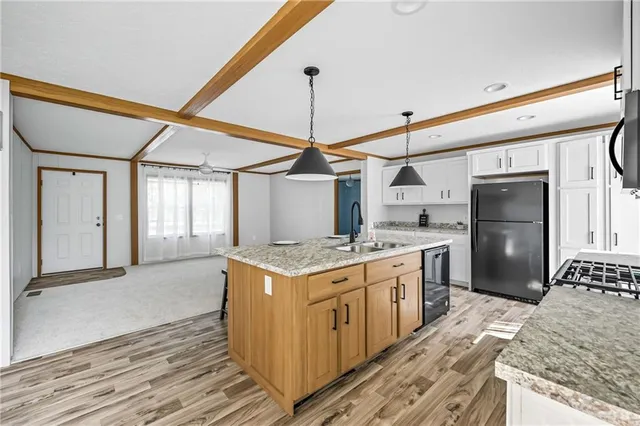 a kitchen with a stove and a refrigerator